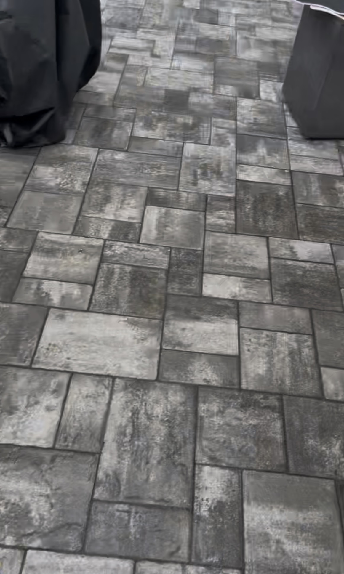 Bright, clean concrete driveway after professional pressure washing