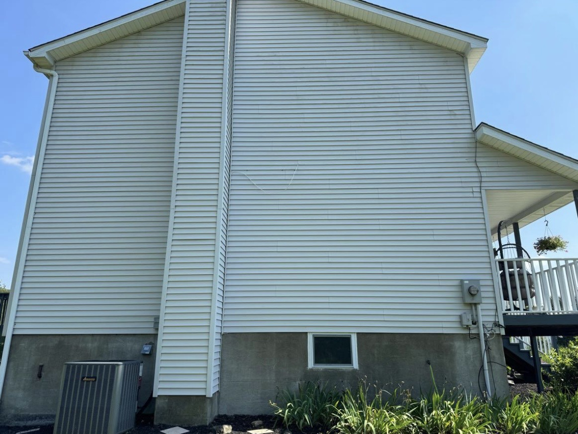 Clean white vinyl siding after soft washing by ACE