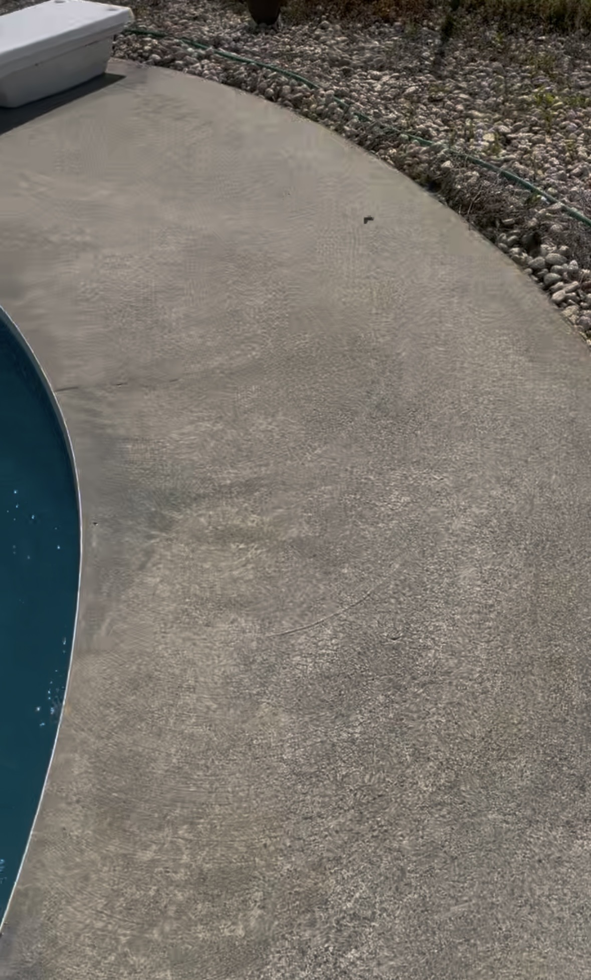 Clean concrete pool deck after pressure washing