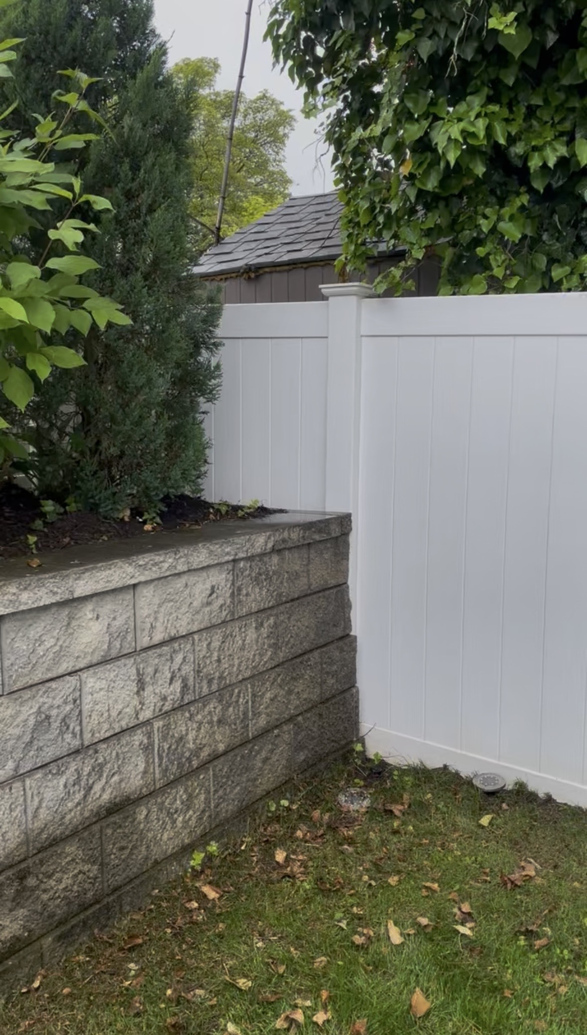 Bright white vinyl fence after cleaning