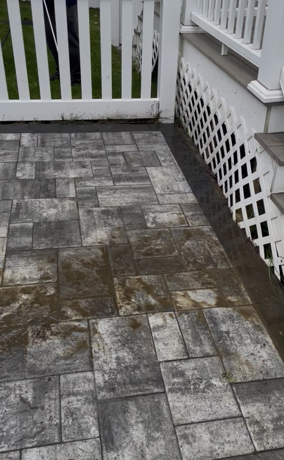 Stained concrete driveway before pressure washing